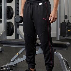 PUMA Men's Black Track Pants with Pink Piping. Size M